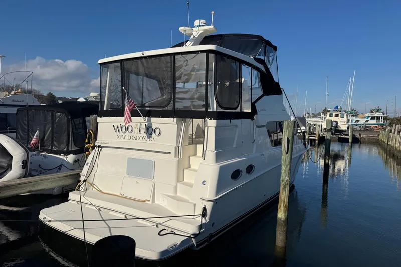  Yacht Photos Pics 2000 Silverton 392 Motor Yacht docked at marina, clear sky, calm water.