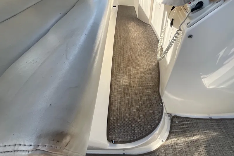  Yacht Photos Pics Interior view of a 2000 Silverton 392 Motor Yacht, featuring seating and carpeted flooring.