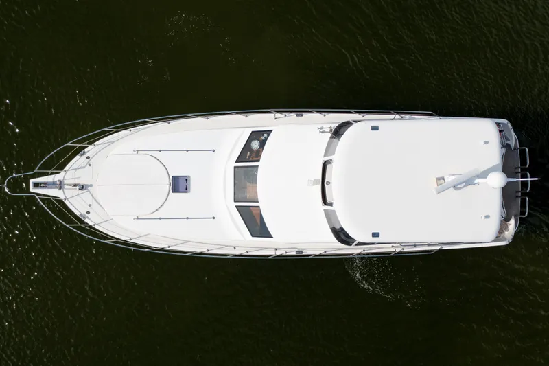  Yacht Photos Pics Top view of 2007 Ocean Alexander 52 Pilothouse yacht on water.