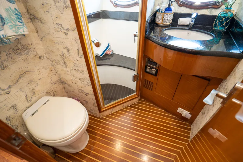  Yacht Photos Pics Luxurious bathroom in 2007 Ocean Alexander 52 Pilothouse yacht with wood flooring and elegant fixtures.