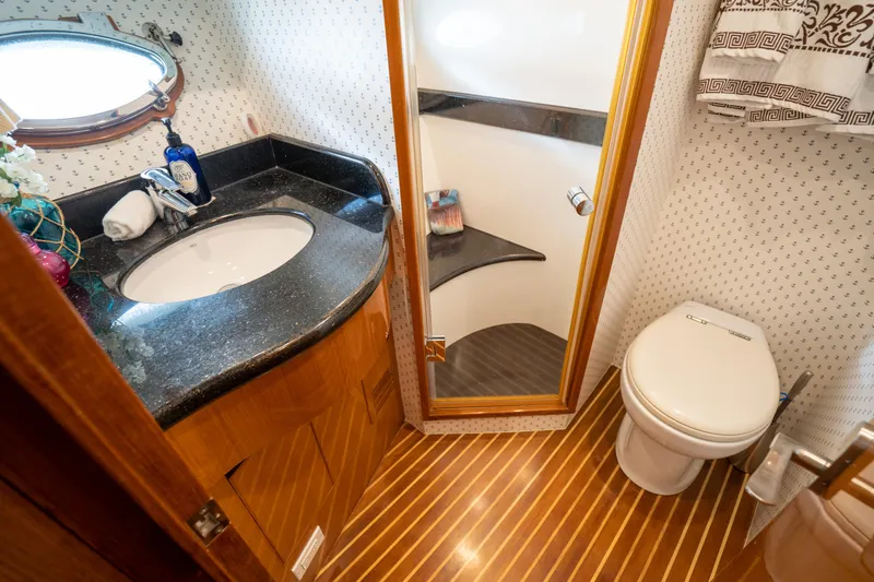  Yacht Photos Pics Luxurious bathroom in 2007 Ocean Alexander 52 Pilothouse yacht with elegant wood flooring.