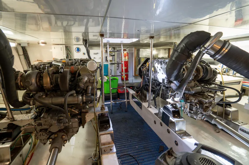  Yacht Photos Pics Engine room of 2007 Ocean Alexander 52 Pilothouse yacht, showcasing dual engines and mechanical systems.