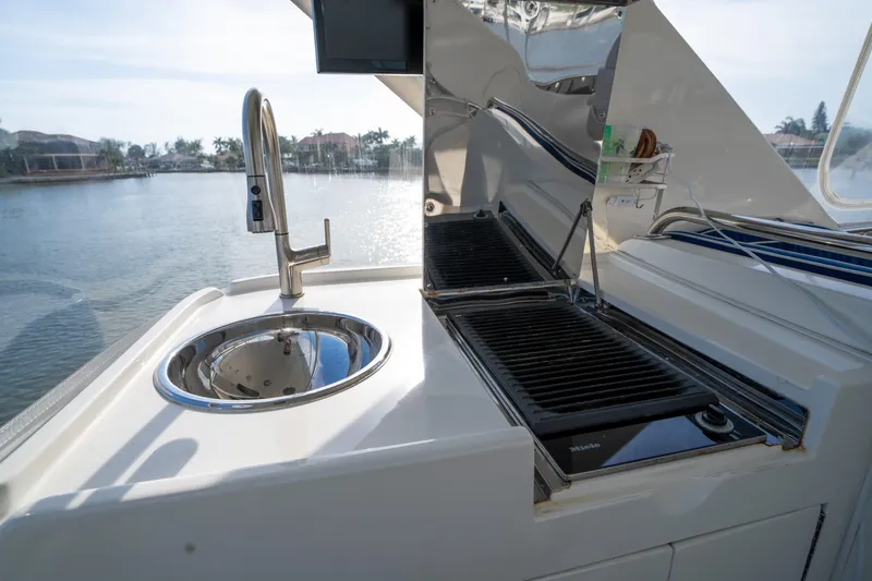  Yacht Photos Pics Outdoor kitchen on 2007 Ocean Alexander 52 Pilothouse yacht with sink and grill.