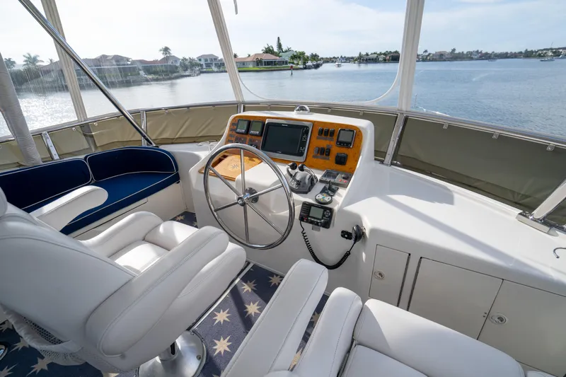  Yacht Photos Pics Pilothouse of 2007 Ocean Alexander 52 yacht with steering wheel and navigation equipment.