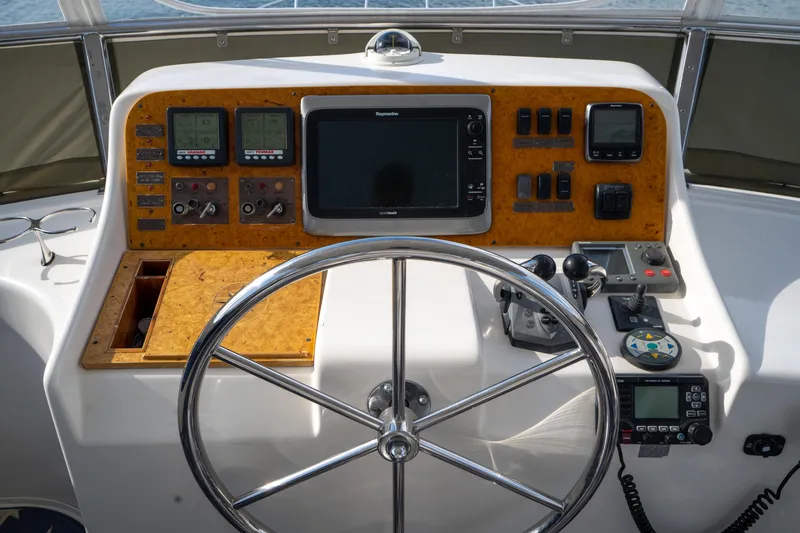  Yacht Photos Pics 2007 Ocean Alexander 52 Pilothouse helm with navigation instruments and steering wheel.
