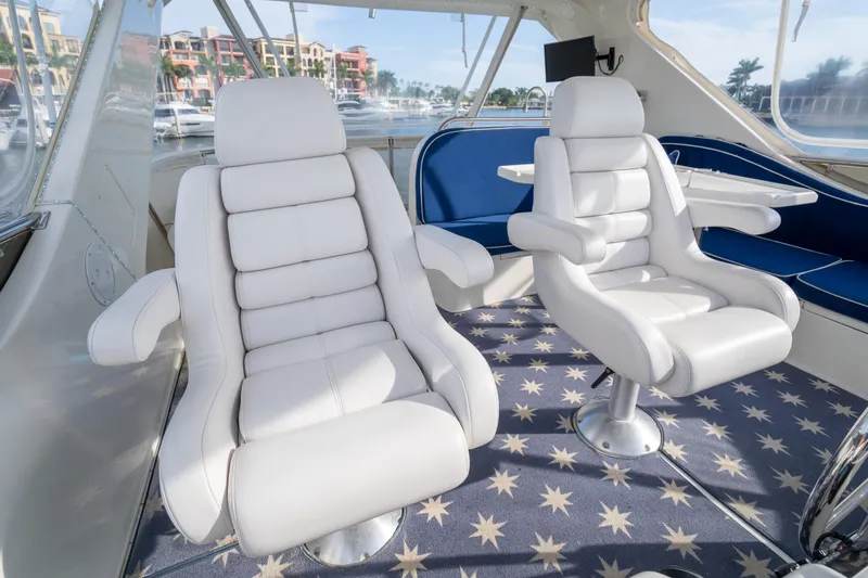  Yacht Photos Pics Luxurious interior of 2007 Ocean Alexander 52 Pilothouse with plush white seating.