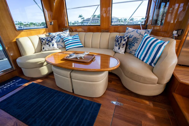  Yacht Photos Pics Luxurious interior of 2007 Ocean Alexander 52 Pilothouse with plush seating and decorative pillows.