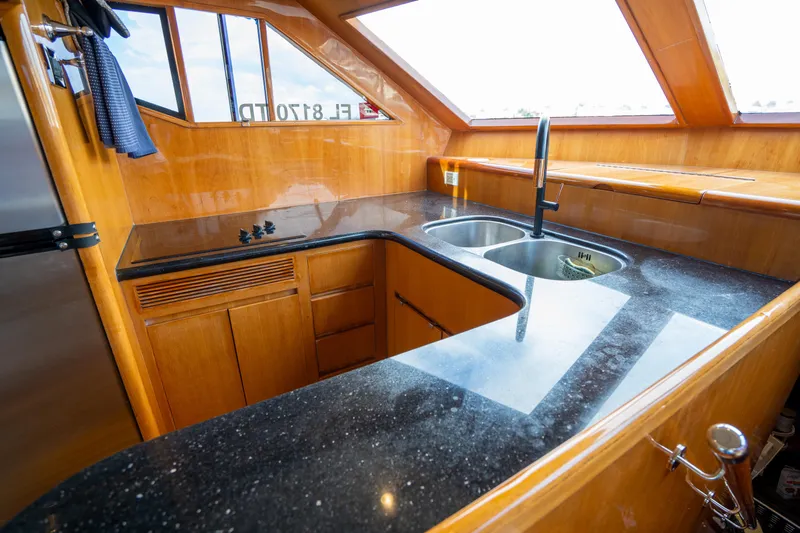  Yacht Photos Pics Luxurious kitchen in 2007 Ocean Alexander 52 Pilothouse yacht with sleek countertops and modern fixtures.