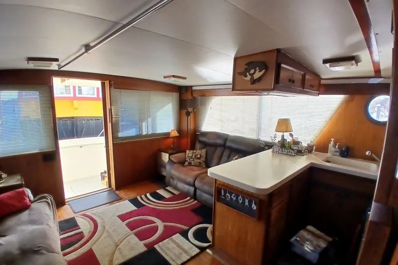 Concrete Idea Yacht Photos Pics Interior of 1977 Hatteras 48 Long Range Cruiser with cozy seating and nautical decor.