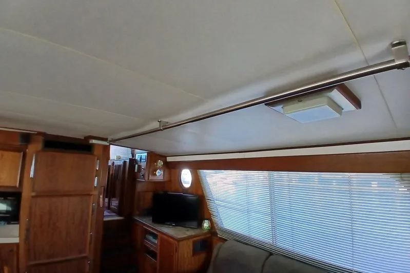 Concrete Idea Yacht Photos Pics Interior of 1977 Hatteras 48 Long Range Cruiser with wood paneling and modern amenities.
