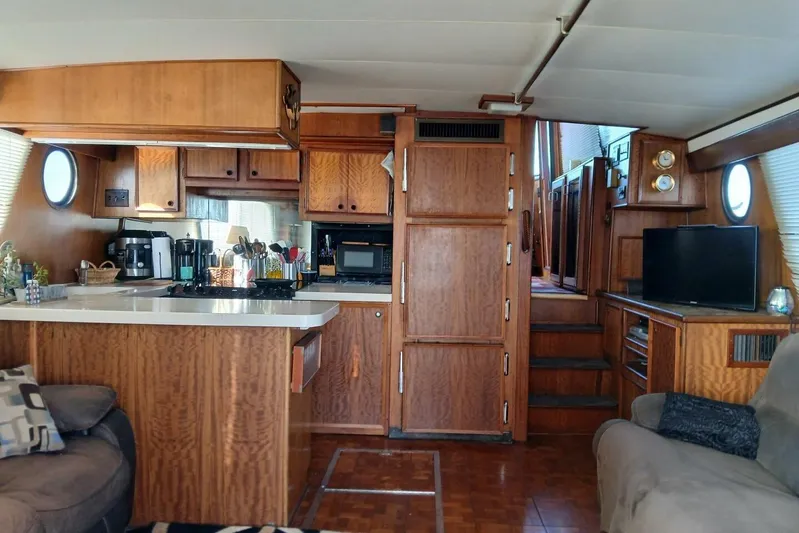 Concrete Idea Yacht Photos Pics Interior of 1977 Hatteras 48 Long Range Cruiser with wood cabinetry and modern amenities.