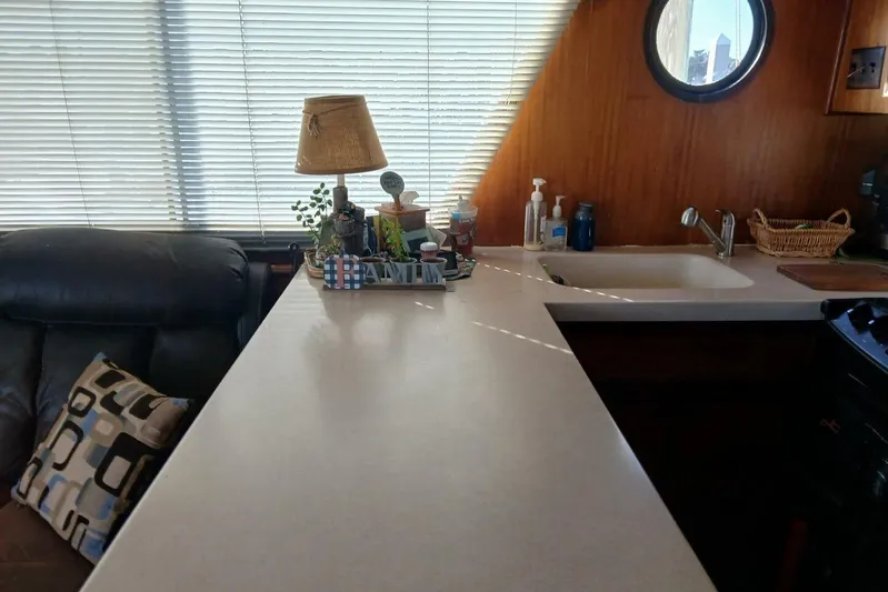 Concrete Idea Yacht Photos Pics Interior of 1977 Hatteras 48 Long Range Cruiser with kitchen counter and decor.