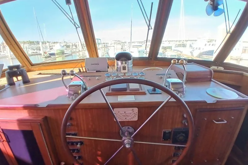 Concrete Idea Yacht Photos Pics Helm of 1977 Hatteras 48 Long Range Cruiser with navigation equipment and marina view.