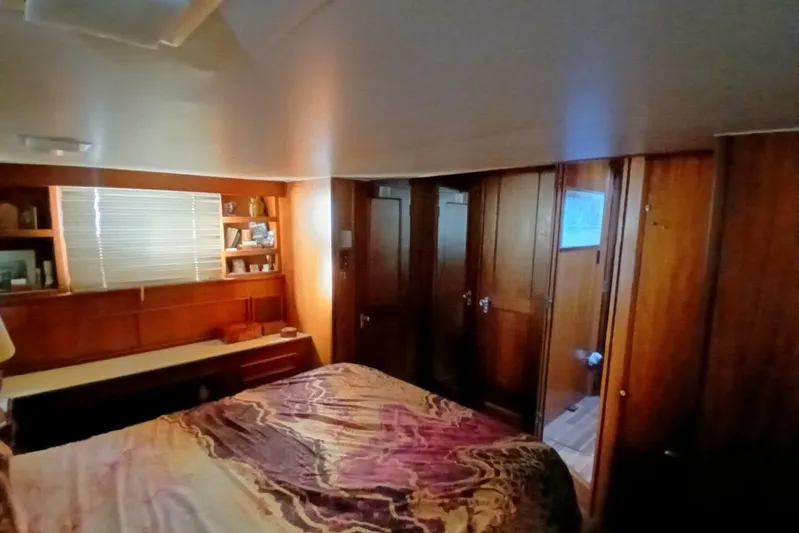 Concrete Idea Yacht Photos Pics 1977 Hatteras 48 Long Range Cruiser bedroom with wood paneling and cozy decor.