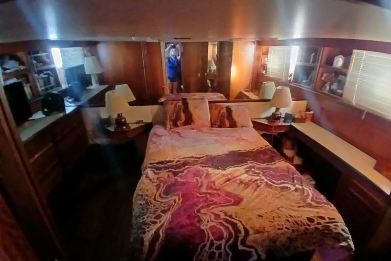 Concrete Idea Yacht Photos Pics Cozy bedroom interior of 1977 Hatteras 48 Long Range Cruiser with vibrant bedding.