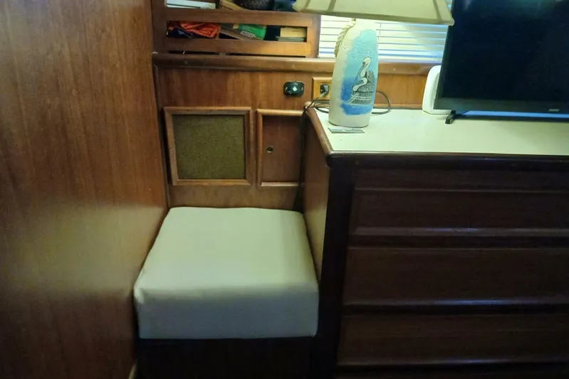 Concrete Idea Yacht Photos Pics 1977 Hatteras 48 Long Range Cruiser interior with wooden cabinetry and cushioned seating.