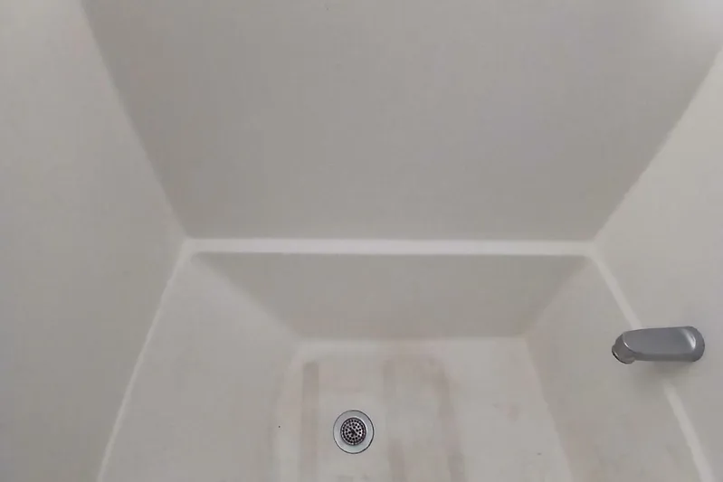 Concrete Idea Yacht Photos Pics Interior of 1977 Hatteras 48 Long Range Cruiser shower with drain and faucet.