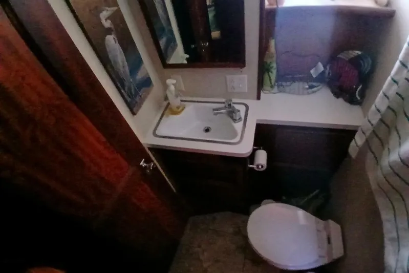 Concrete Idea Yacht Photos Pics Bathroom interior of 1977 Hatteras 48 Long Range Cruiser with sink and toilet.