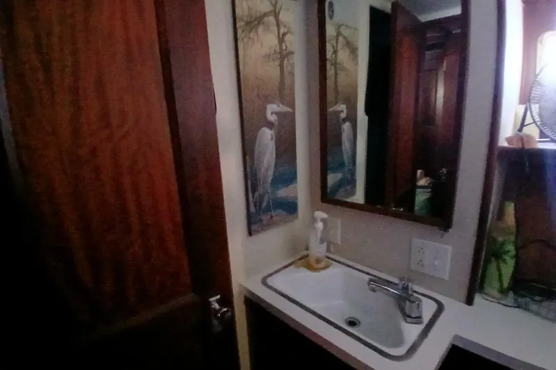 Concrete Idea Yacht Photos Pics Bathroom interior of 1977 Hatteras 48 Long Range Cruiser with sink and mirror.