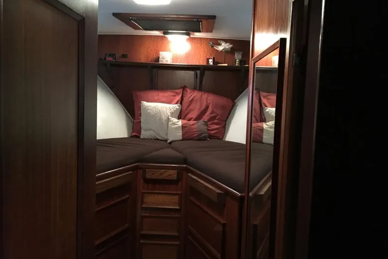 Concrete Idea Yacht Photos Pics Cozy cabin interior of 1977 Hatteras 48 Long Range Cruiser with wood paneling and plush bedding.
