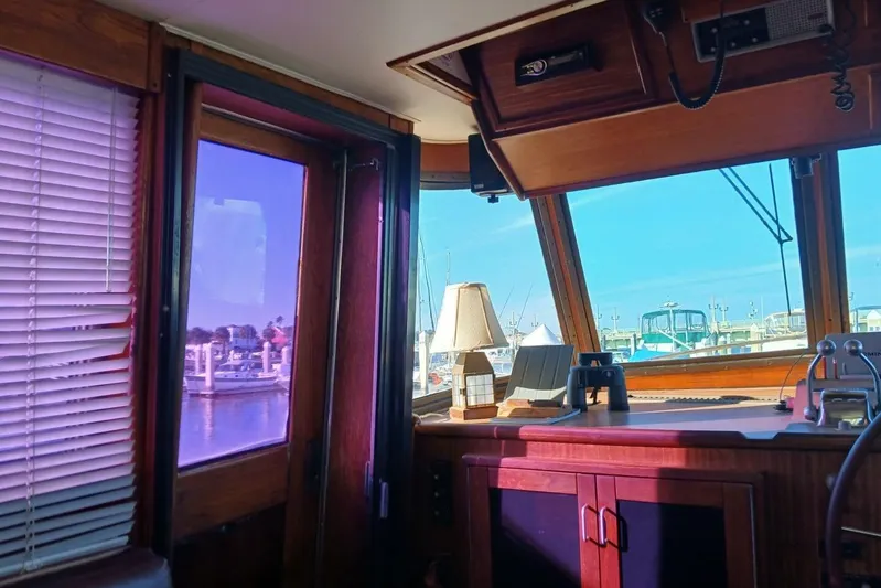 Concrete Idea Yacht Photos Pics Interior view of 1977 Hatteras 48 Long Range Cruiser with marina in background.