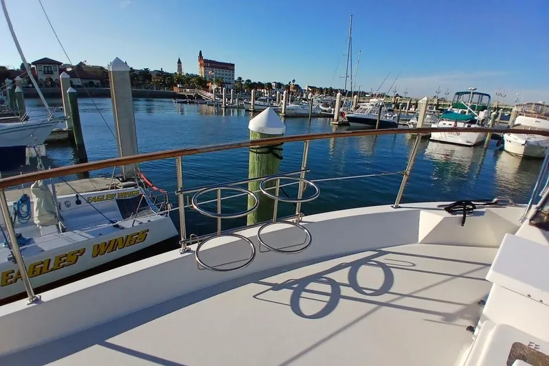 Concrete Idea Yacht Photos Pics 1977 Hatteras 48 Long Range Cruiser docked in a scenic marina.