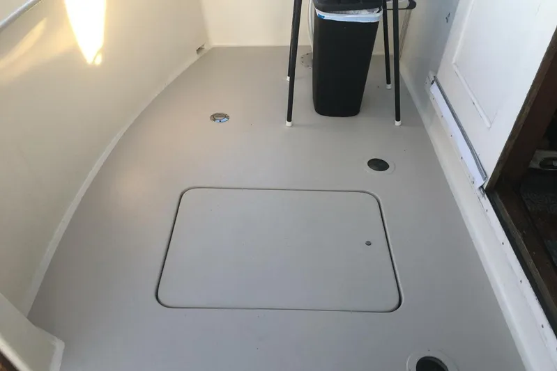 Concrete Idea Yacht Photos Pics 1977 Hatteras 48 Long Range Cruiser deck with storage hatch and trash bin.