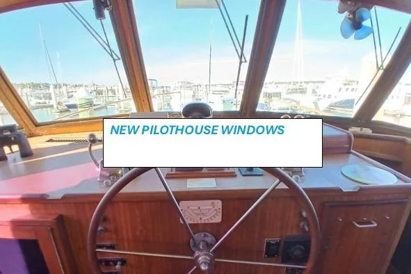 Concrete Idea Yacht Photos Pics 1977 Hatteras 48 Long Range Cruiser pilothouse with new windows and classic wooden steering wheel.