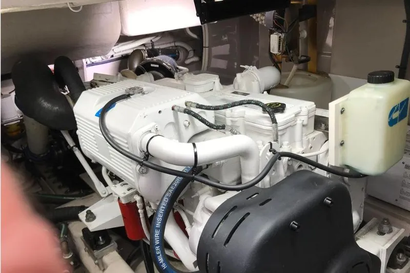 Ocean Blue III Yacht Photos Pics Engine room of a 2010 Sea Ray Sundancer 540 yacht, showcasing mechanical components.