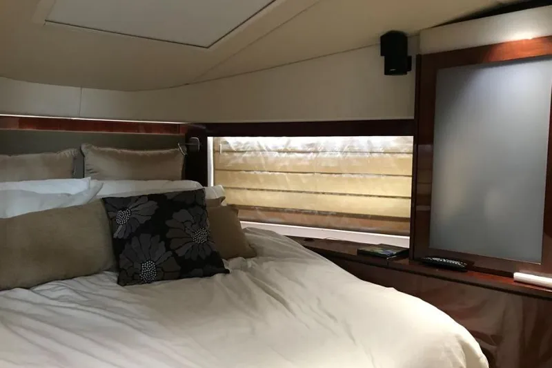 Ocean Blue III Yacht Photos Pics Luxurious bedroom interior of 2010 Sea Ray Sundancer 540 yacht with elegant bedding.