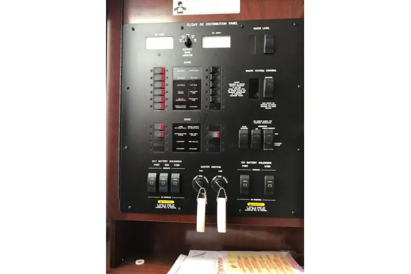 Ocean Blue III Yacht Photos Pics Control panel of a 2010 Sea Ray Sundancer 540 yacht, featuring various switches and indicators.