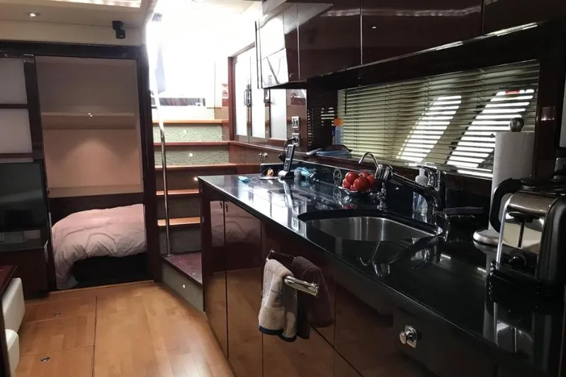 Ocean Blue III Yacht Photos Pics Luxurious 2010 Sea Ray Sundancer 540 yacht interior with modern kitchen and cozy bedroom.