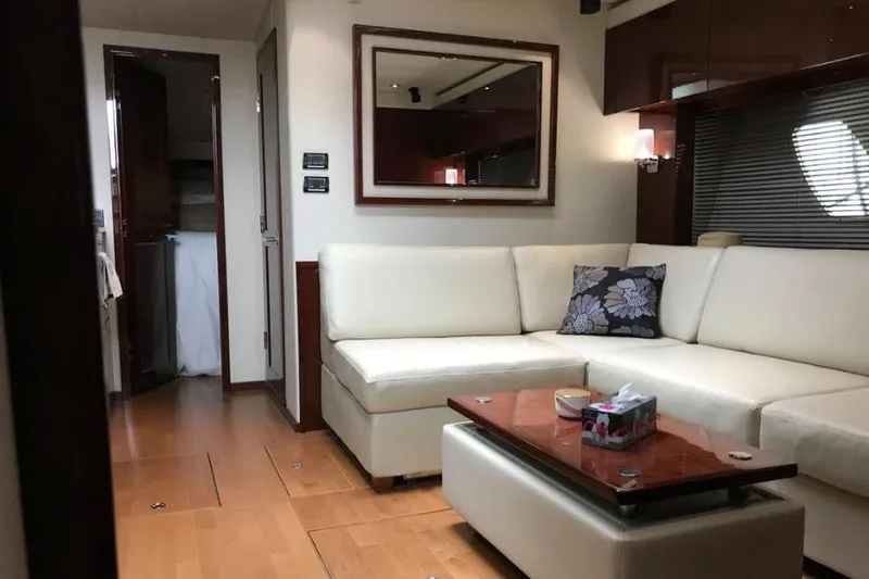 Ocean Blue III Yacht Photos Pics Luxurious interior of 2010 Sea Ray Sundancer 540 yacht with elegant white seating.