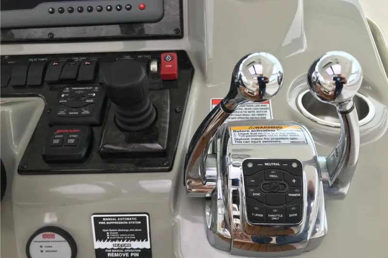 Ocean Blue III Yacht Photos Pics Control panel of a 2010 Sea Ray Sundancer 540 yacht with throttle levers and joystick.