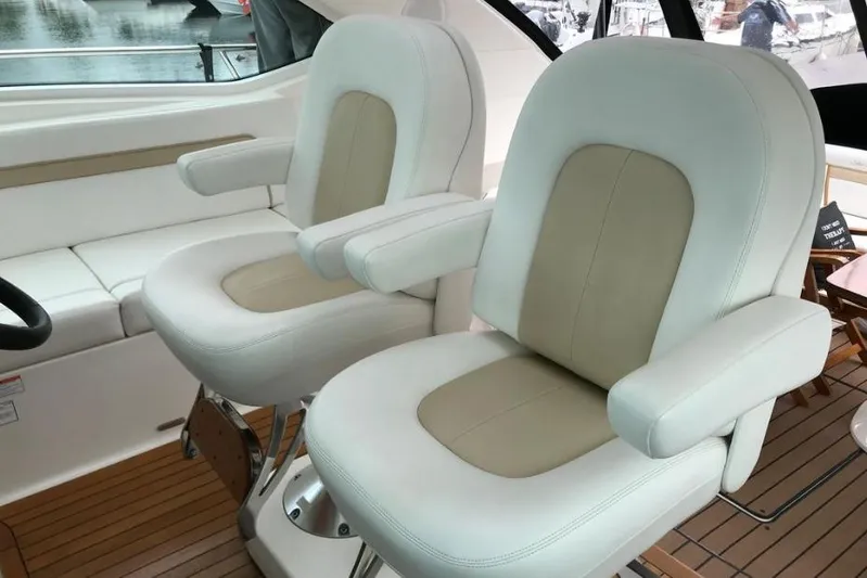 Ocean Blue III Yacht Photos Pics Luxury seating on 2010 Sea Ray Sundancer 540 yacht, featuring plush white and beige chairs.