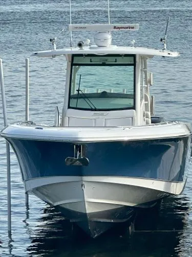  Yacht Photos Pics 2016 Boston Whaler 350 Outrage boat on water, front view.