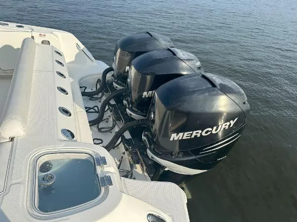  Yacht Photos Pics 2016 Boston Whaler 350 Outrage with triple Mercury outboard engines on water.