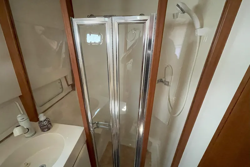  Yacht Photos Pics Bathroom with shower and sink in 2000 Mainship 390 Trawler yacht.
