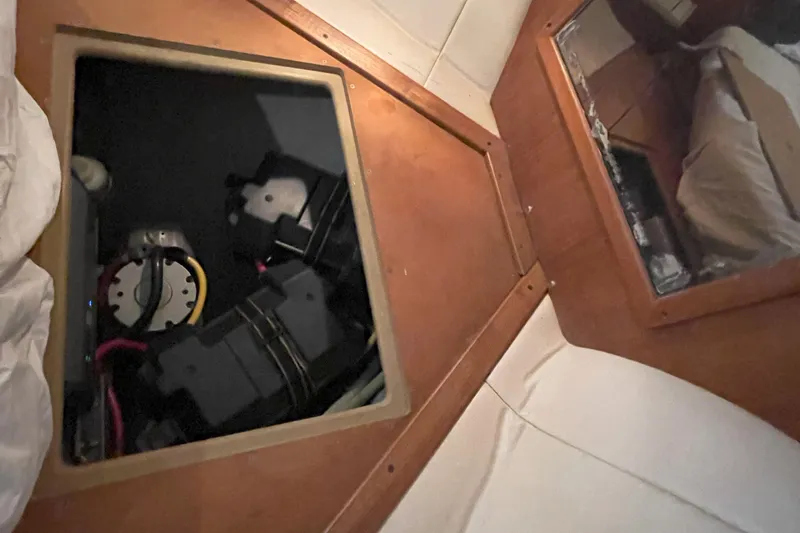  Yacht Photos Pics Interior view of a 2000 Mainship 390 Trawler, showing an open compartment with wiring.