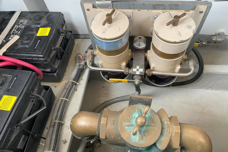  Yacht Photos Pics Engine room of 2000 Mainship 390 Trawler with batteries and fuel filters.