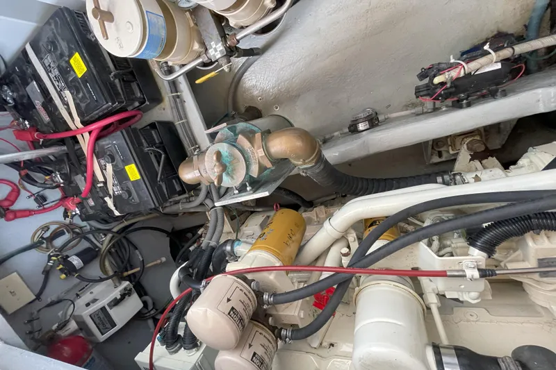  Yacht Photos Pics Engine room of 2000 Mainship 390 Trawler with visible batteries and wiring.