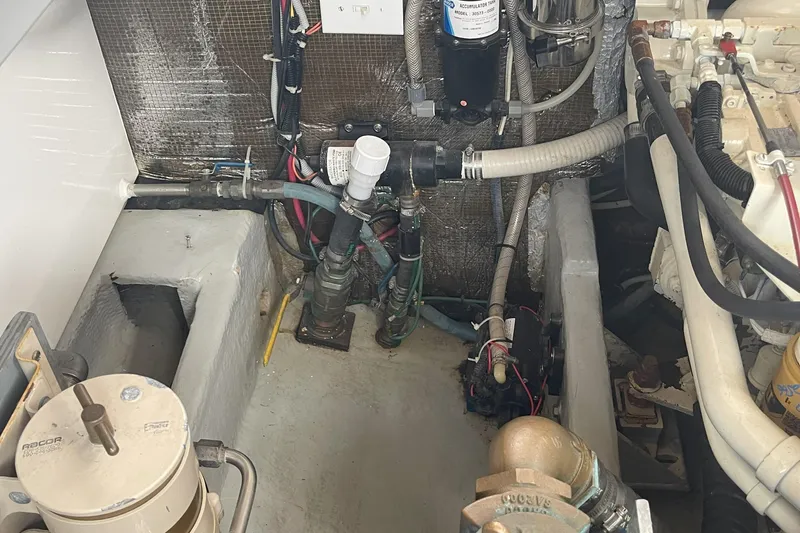  Yacht Photos Pics Engine room of a 2000 Mainship 390 Trawler, showing mechanical components and wiring.