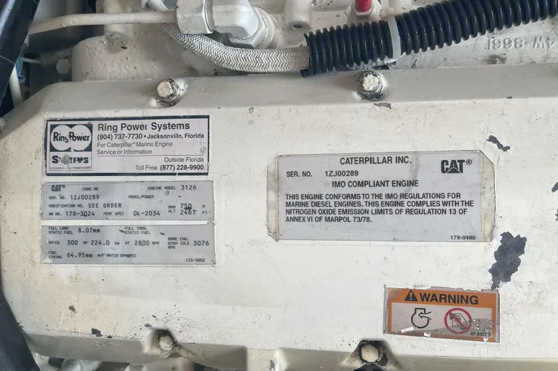  Yacht Photos Pics Caterpillar marine engine label on 2000 Mainship 390 Trawler, featuring compliance and specifications.