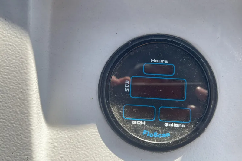  Yacht Photos Pics FloScan gauge on 2000 Mainship 390 Trawler dashboard, displaying hours, RPM, GPH, and gallons.