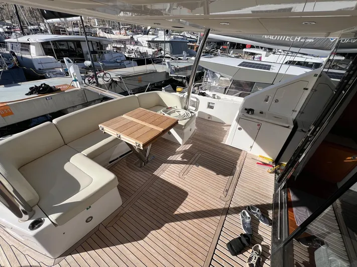  Yacht Photos Pics Luxurious 2016 Sunseeker 75 Yacht deck with seating and table, docked at marina.