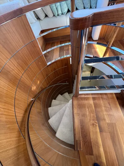  Yacht Photos Pics Spiral staircase on 2016 Sunseeker 75 Yacht with elegant wood finish.