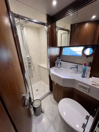  Yacht Photos Pics Luxurious bathroom in 2016 Sunseeker 75 Yacht with modern fixtures and shower.