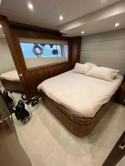  Yacht Photos Pics Luxurious bedroom interior of a 2016 Sunseeker 75 Yacht with modern design elements.
