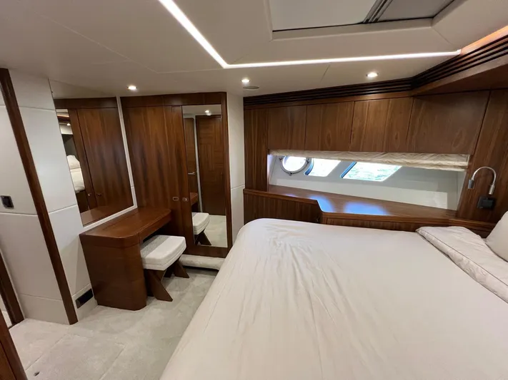  Yacht Photos Pics Luxurious cabin interior of 2016 Sunseeker 75 Yacht with elegant wood finishes.