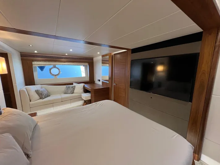  Yacht Photos Pics Luxurious interior of 2016 Sunseeker 75 Yacht with bed, sofa, and large TV.